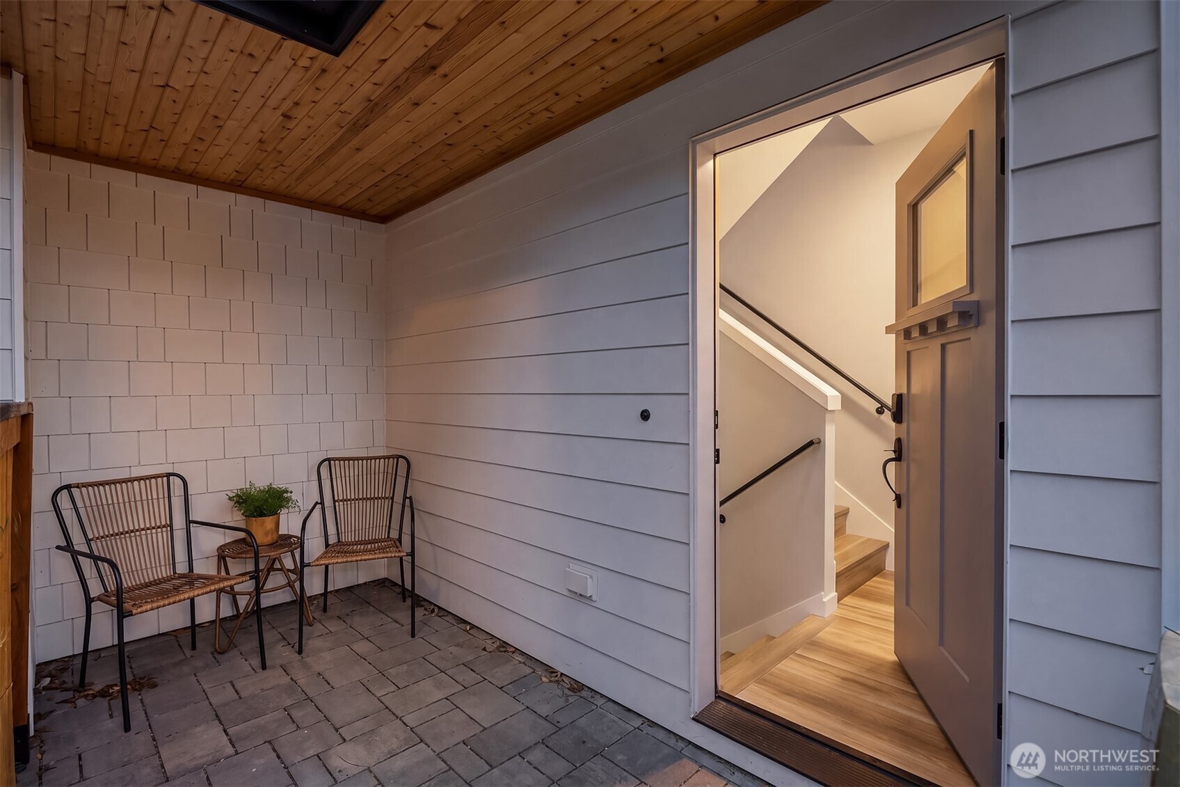 516 North 61st Street, Unit B Seattle, WA 98103 - Photo 3 of 17 a view of a patio with table and chairs