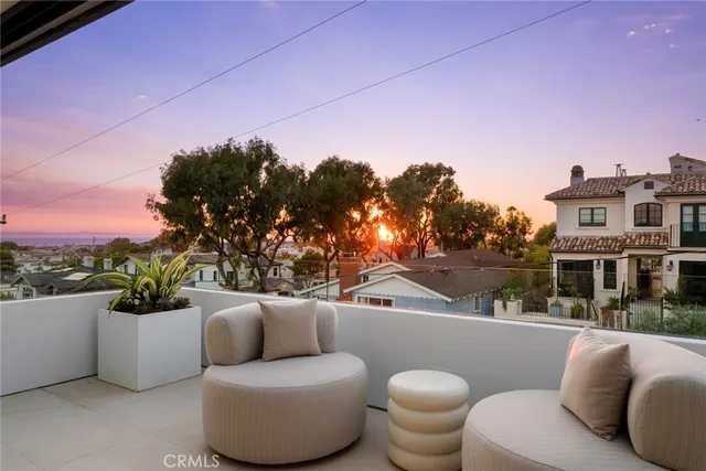 a view of a patio with couches and potted plants