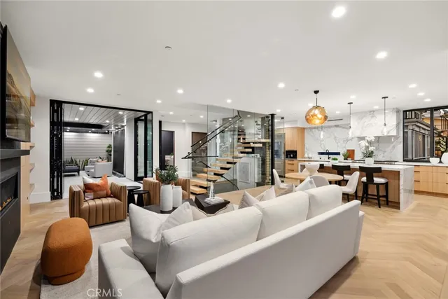 a view of a roof deck with couches and sky view