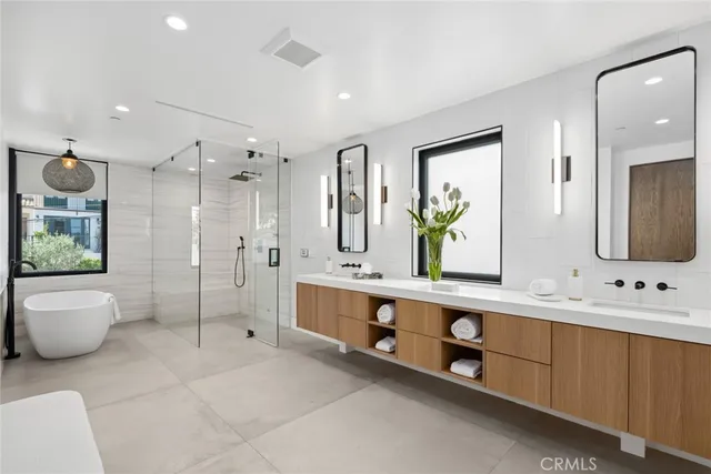 a living room with patio furniture and a potted plants