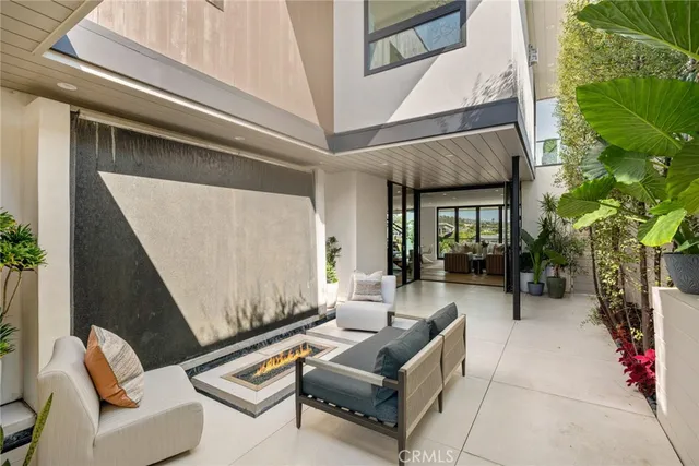 a outdoor living space with furniture and a potted plant