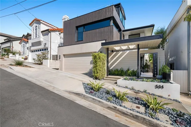 a bedroom with a large bed and a large window