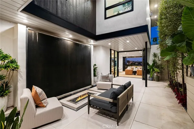 a outdoor living space with furniture and a potted plant