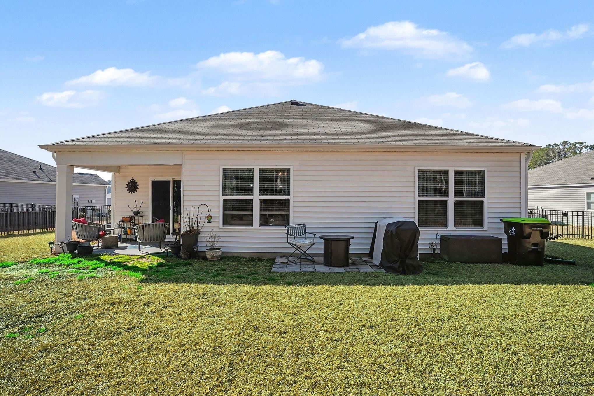 172 Seasons Trace Loop Longs, SC 29568 - Photo 28 of 37 Back of house with a patio area and a shingled roof