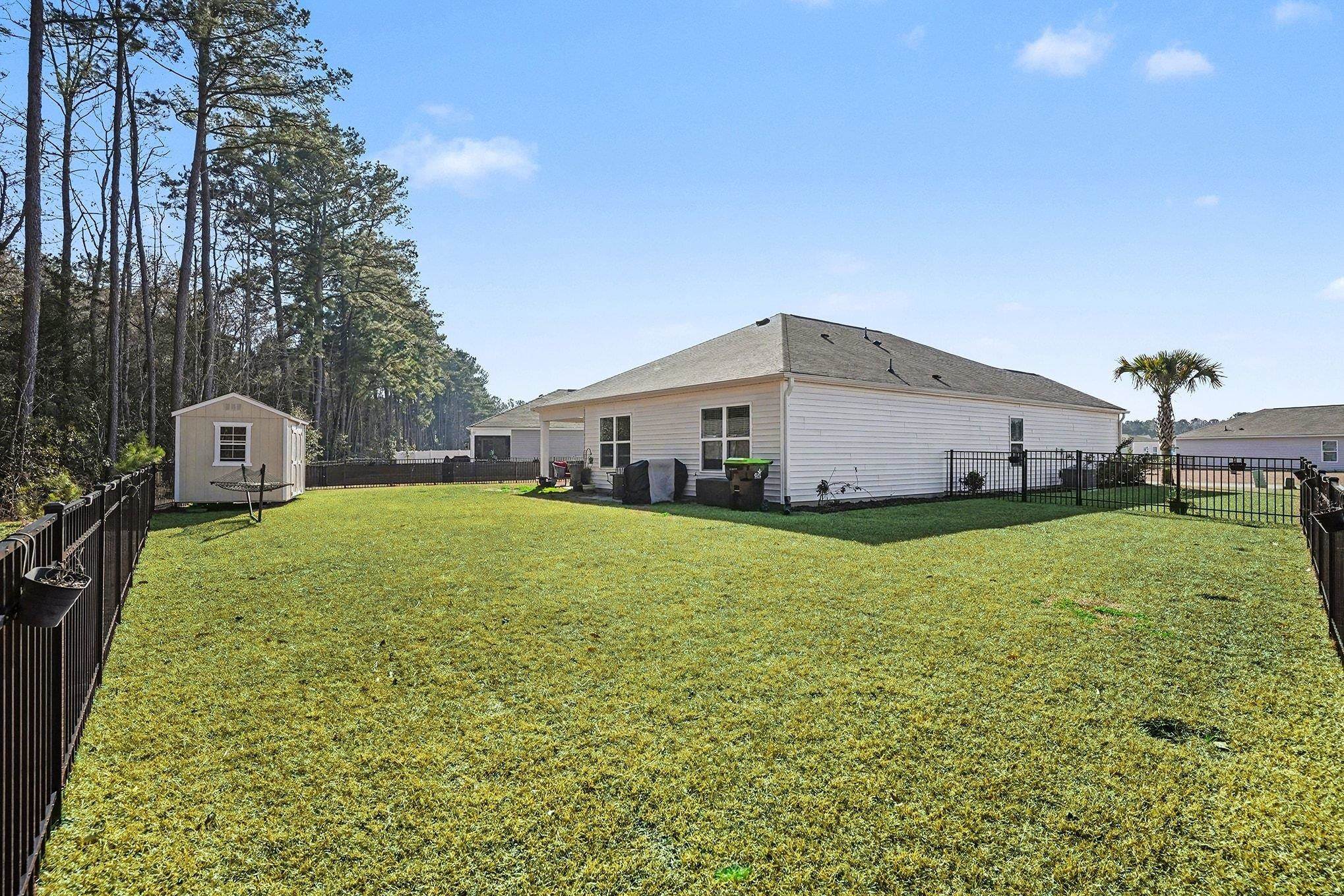 172 Seasons Trace Loop Longs, SC 29568 - Photo 32 of 37 Fenced backyard featuring a shed
