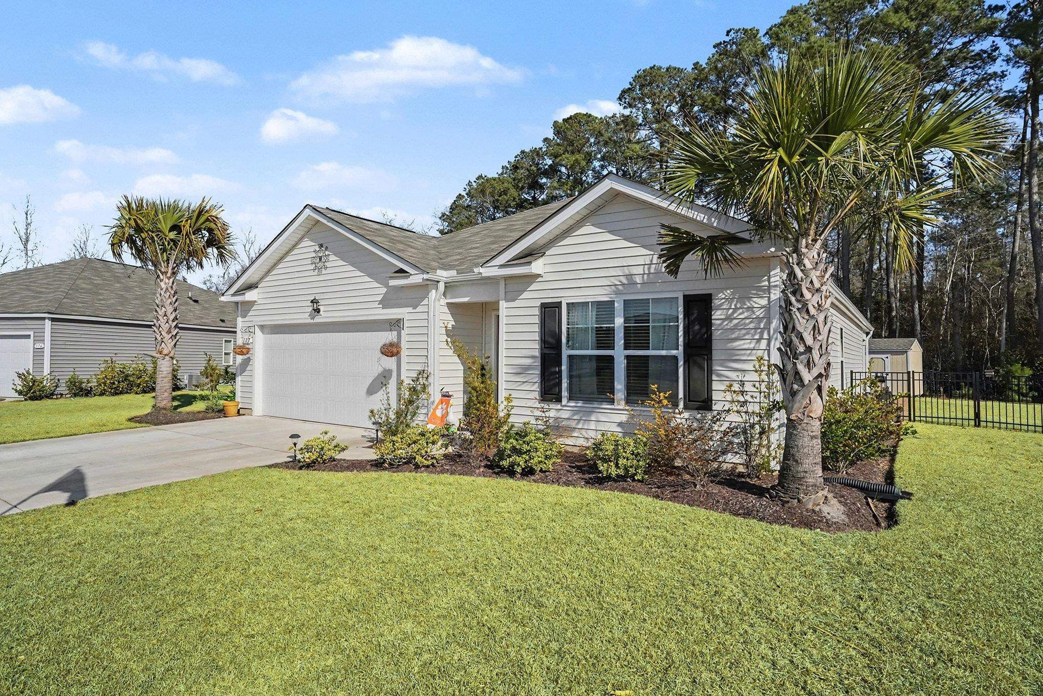 172 Seasons Trace Loop Longs, SC 29568 - Photo 5 of 37 Single story home with concrete driveway and a garage
