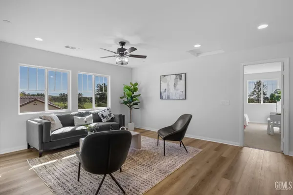 a living room with furniture and a large window