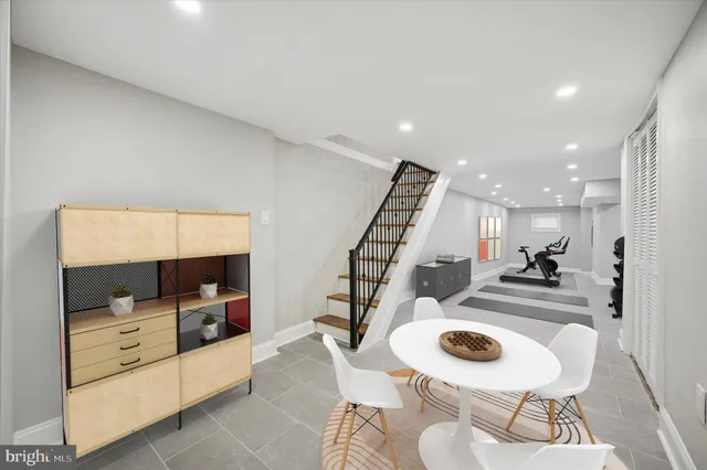 a kitchen with furniture and a view of living room
