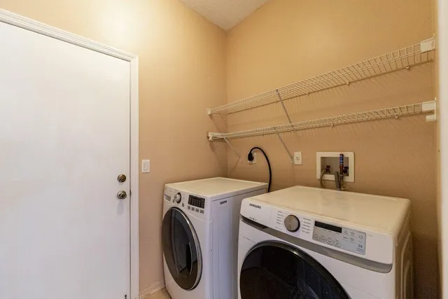 a utility room with dryer and washer