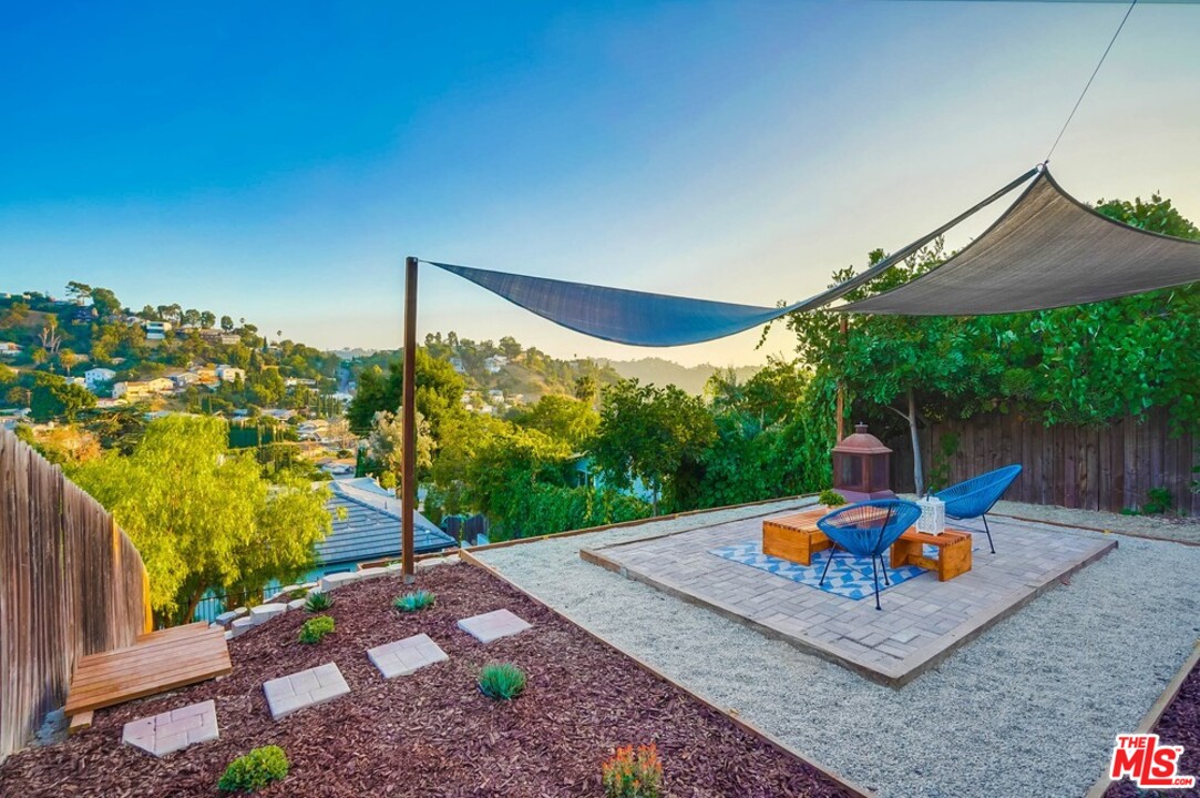 2049 Rome Drive Los Angeles, CA 90065 - Photo 1 of 43 a front view of a house with a yard