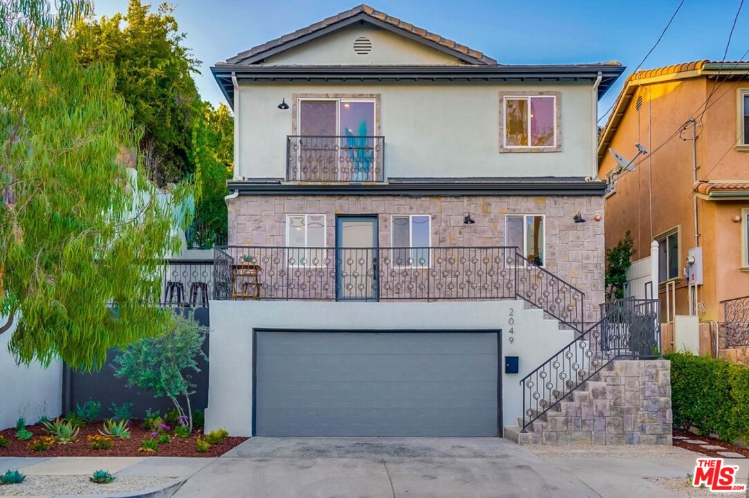 2049 Rome Drive Los Angeles, CA 90065 - Photo 2 of 43 a front view of a house with a yard
