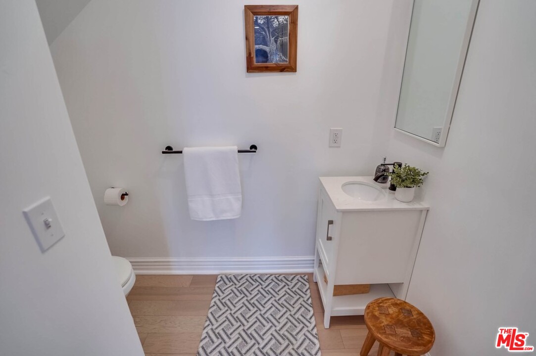 2049 Rome Drive Los Angeles, CA 90065 - Photo 16 of 43 a bathroom with a sink toilet and vanity