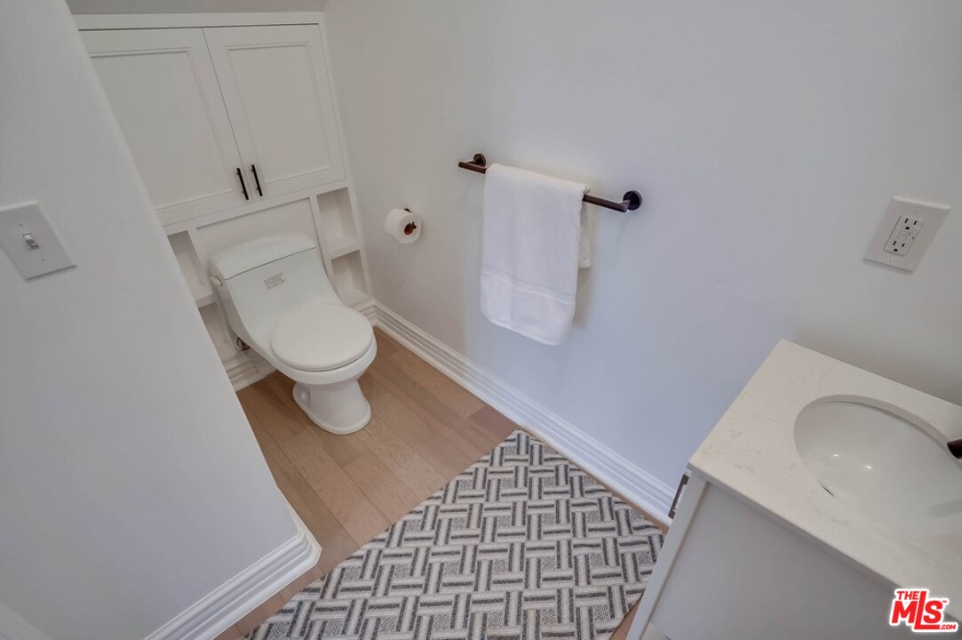 2049 Rome Drive Los Angeles, CA 90065 - Photo 17 of 43 a bathroom with a toilet and a sink