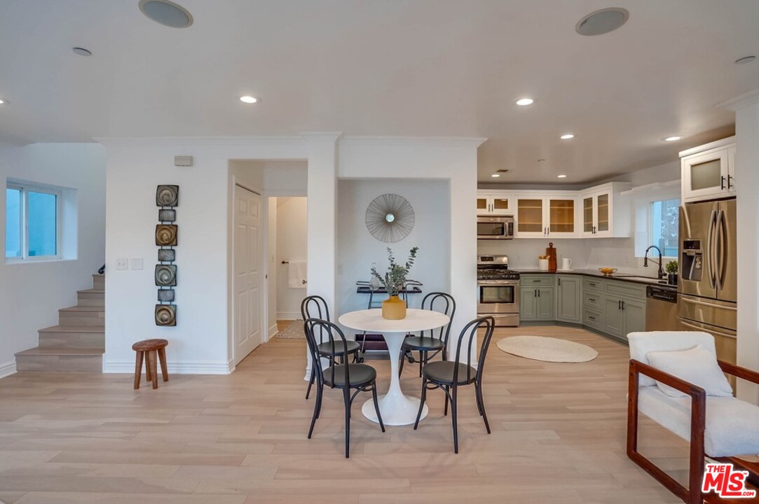 2049 Rome Drive Los Angeles, CA 90065 - Photo 3 of 43 a view of a dining room with furniture and wooden floor