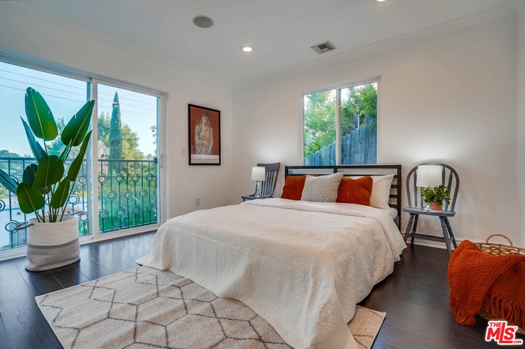 2049 Rome Drive Los Angeles, CA 90065 - Photo 21 of 43 a bedroom with bed and window