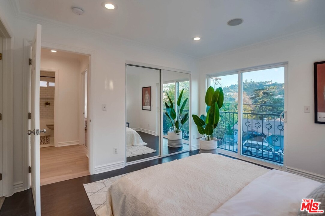 2049 Rome Drive Los Angeles, CA 90065 - Photo 22 of 43 a bedroom with a bed and a large window