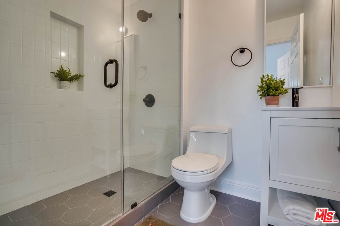 2049 Rome Drive Los Angeles, CA 90065 - Photo 24 of 43 a bathroom with a toilet and a shower