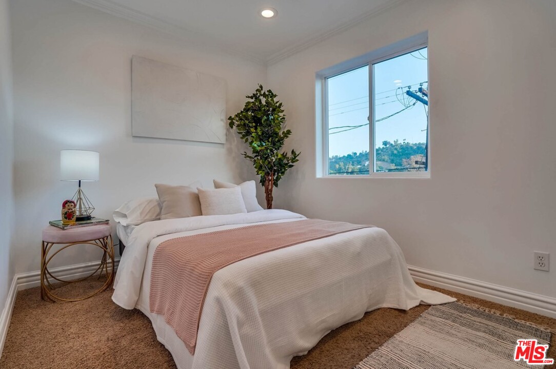 2049 Rome Drive Los Angeles, CA 90065 - Photo 25 of 43 a bedroom with bed and window