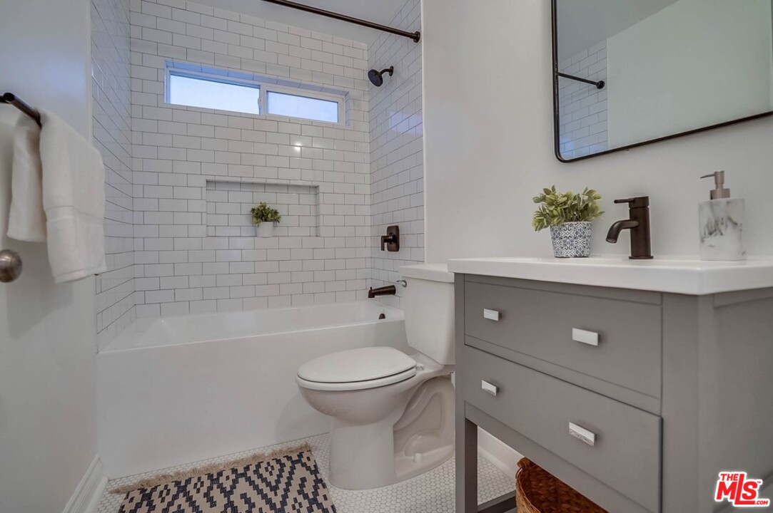 2049 Rome Drive Los Angeles, CA 90065 - Photo 26 of 43 a bathroom with a sink a toilet and shower