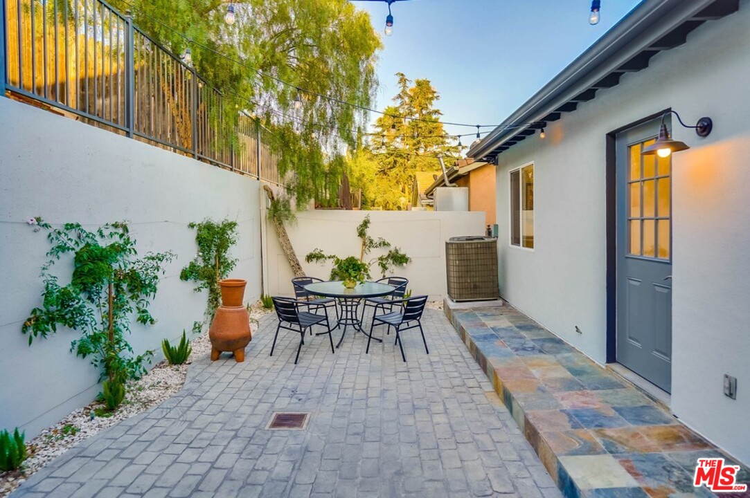 2049 Rome Drive Los Angeles, CA 90065 - Photo 28 of 43 a backyard of a house with table and chairs