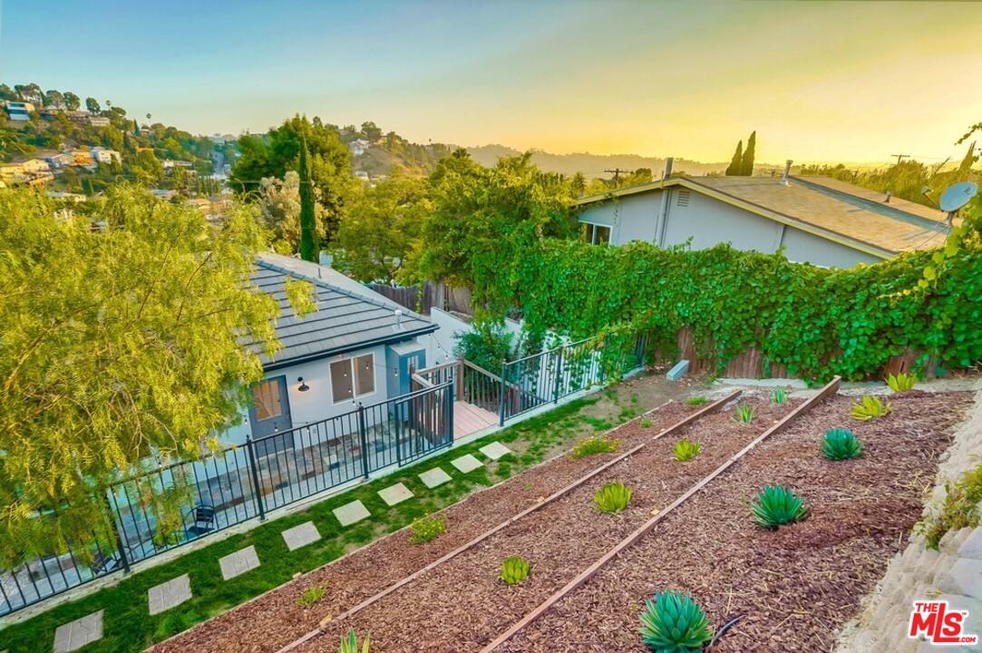 2049 Rome Drive Los Angeles, CA 90065 - Photo 38 of 43 a view of a house with a yard and wooden fence
