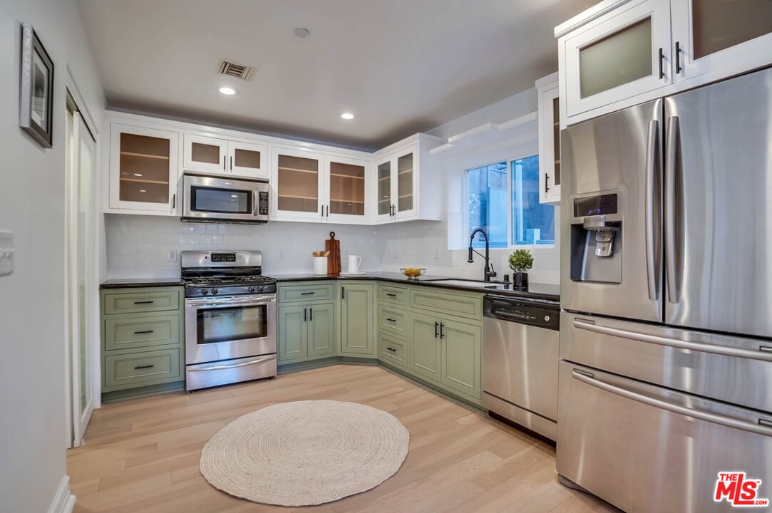 2049 Rome Drive Los Angeles, CA 90065 - Photo 6 of 43 a kitchen with stainless steel appliances granite countertop a refrigerator sink stove and oven