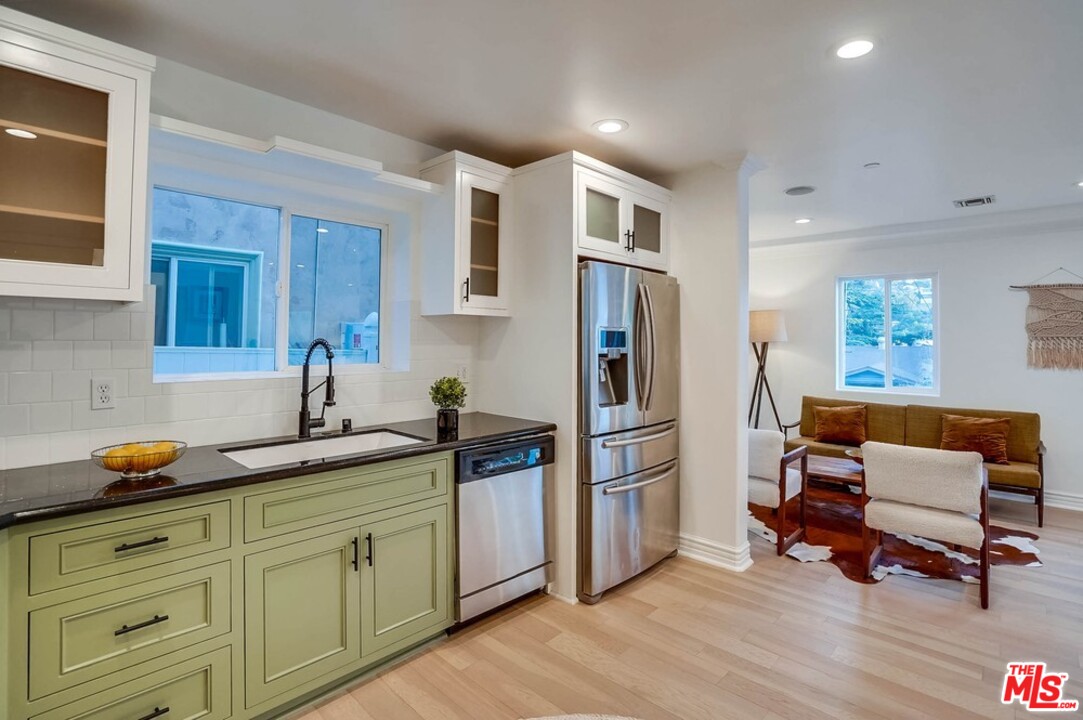 2049 Rome Drive Los Angeles, CA 90065 - Photo 8 of 43 a kitchen with stainless steel appliances granite countertop a refrigerator and a sink