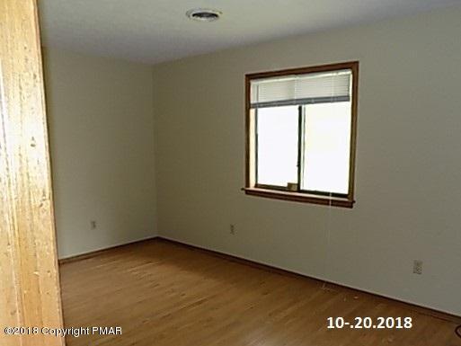 4152 Blueberry Hill Road Bushkill, PA 18324 - Photo 12 of 25 a view of an empty room with a window