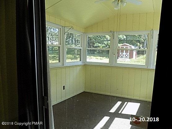 4152 Blueberry Hill Road Bushkill, PA 18324 - Photo 15 of 25 a view of an empty room and a window