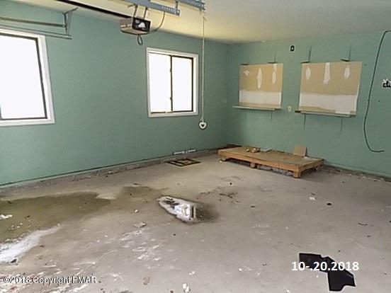 4152 Blueberry Hill Road Bushkill, PA 18324 - Photo 20 of 25 a view of a room with window and a chandelier fan