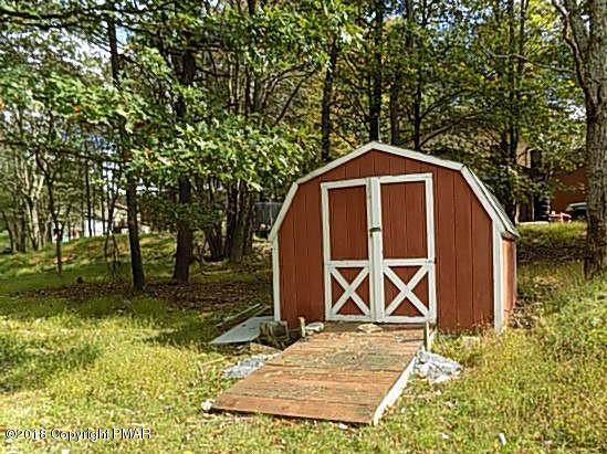 4152 Blueberry Hill Road Bushkill, PA 18324 - Photo 21 of 25 a front view of a house with garden