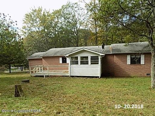 4152 Blueberry Hill Road Bushkill, PA 18324 - Photo 22 of 25 a front view of a house with a yard