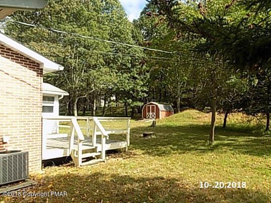 4152 Blueberry Hill Road Bushkill, PA 18324 - Photo 23 of 25 a front view of a house with a yard