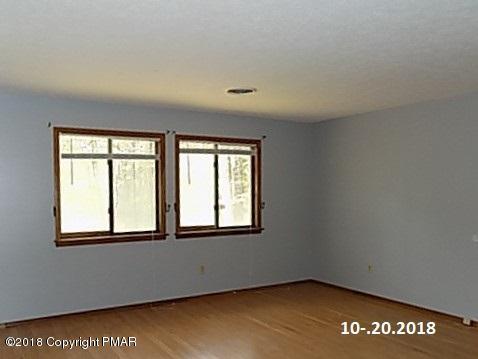 4152 Blueberry Hill Road Bushkill, PA 18324 - Photo 9 of 25 a view of an empty room with a window