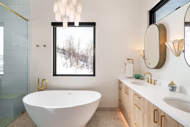 a bathroom with a double vanity sink and a mirror