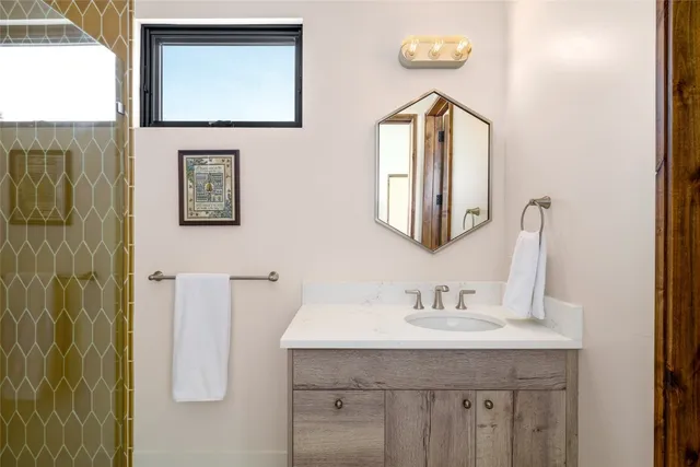 a living room with a couch and a bookshelf