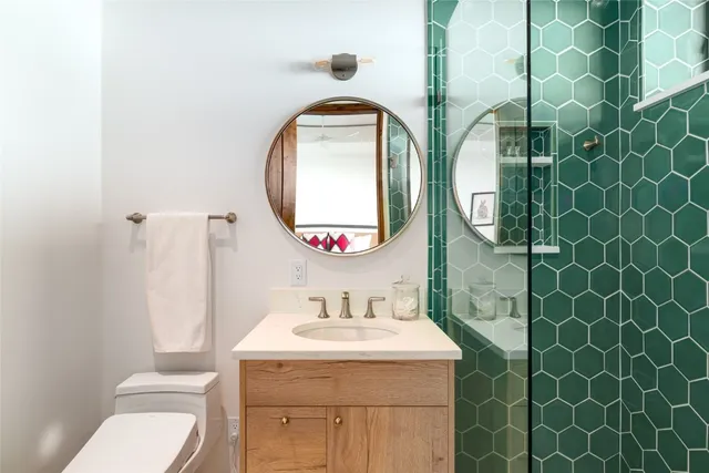 a bathroom with 2 sink and a mirror