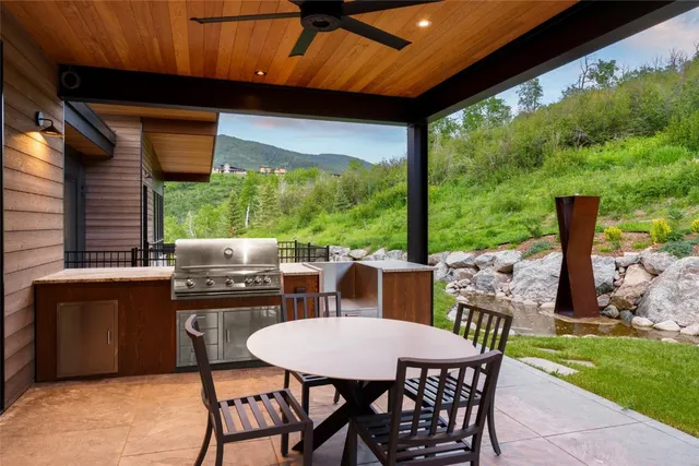 a view of a chairs and table in the garden