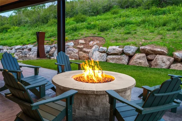 a view of a grassy field with an ocean