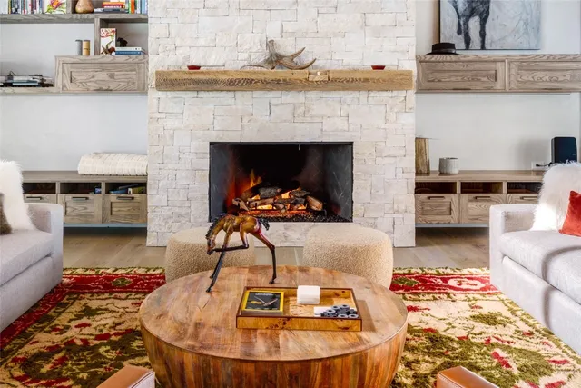 a kitchen with granite countertop a table and chairs in it