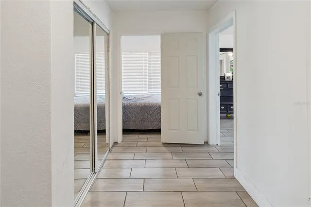 a bedroom with a bed and dresser