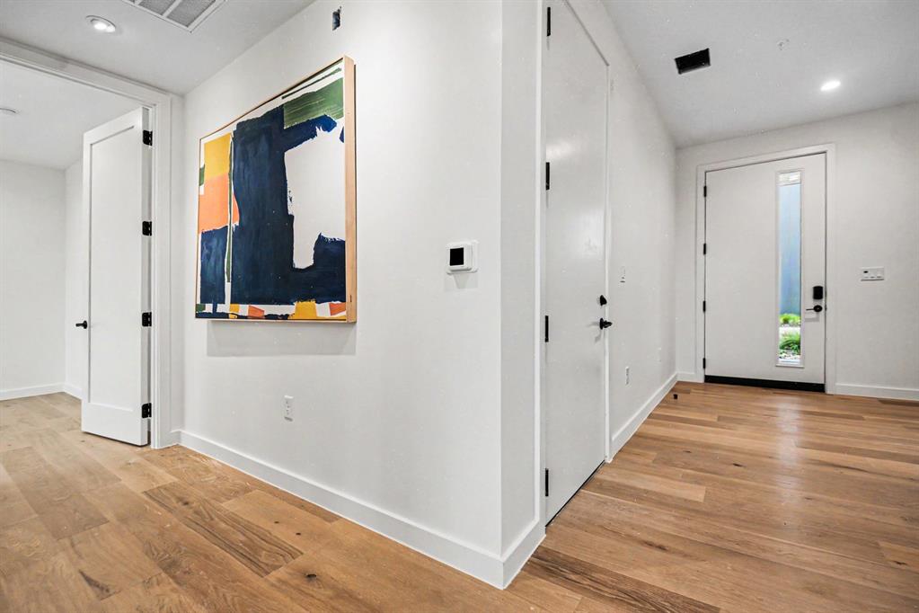 1111 Raiford Road, Unit 121 Carrollton, TX 75007 - Photo 21 of 30 a view of a hallway with wooden floor and staircase