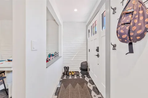 a view of a hallway with seating area