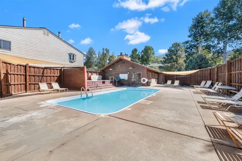 a view of a swimming pool with a patio