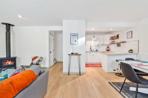a bedroom with furniture and a wooden floor