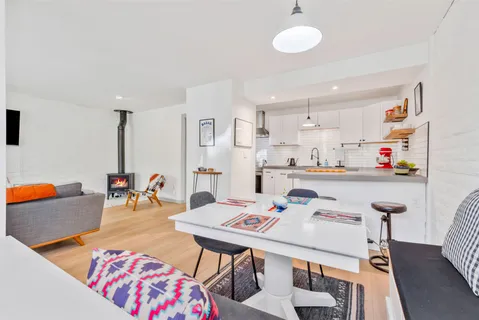 a very nice looking dining room with a table and chairs