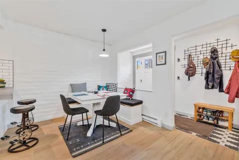 a view of a livingroom with furniture and a wooden floor