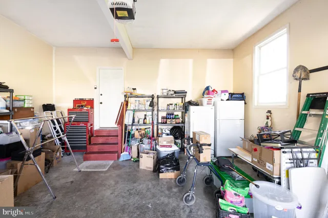 a view of a house with a big yard and large trees