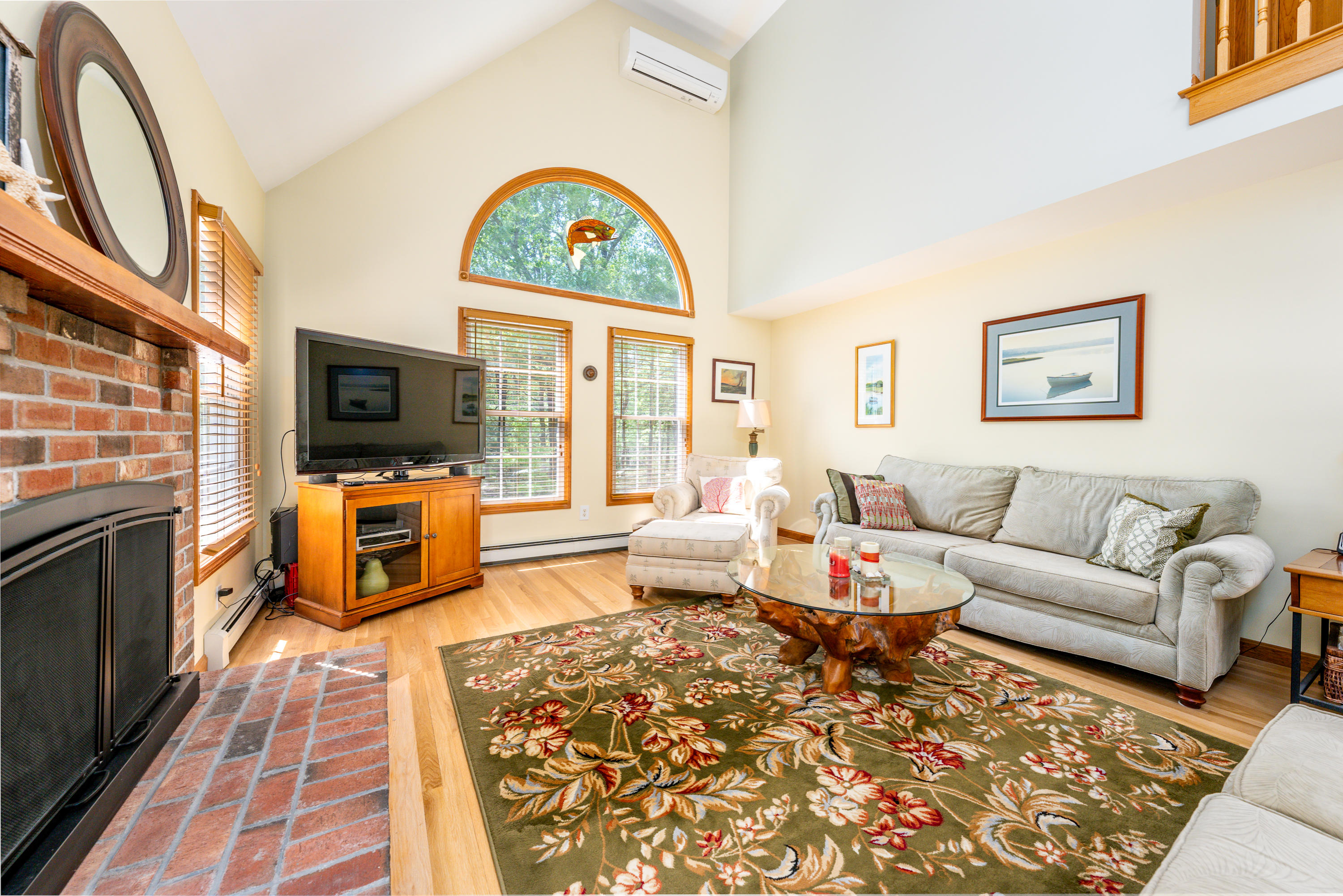 130 Browns Neck Road Wellfleet, MA 02667 - Photo 12 of 40 a living room with fireplace furniture and a flat screen tv
