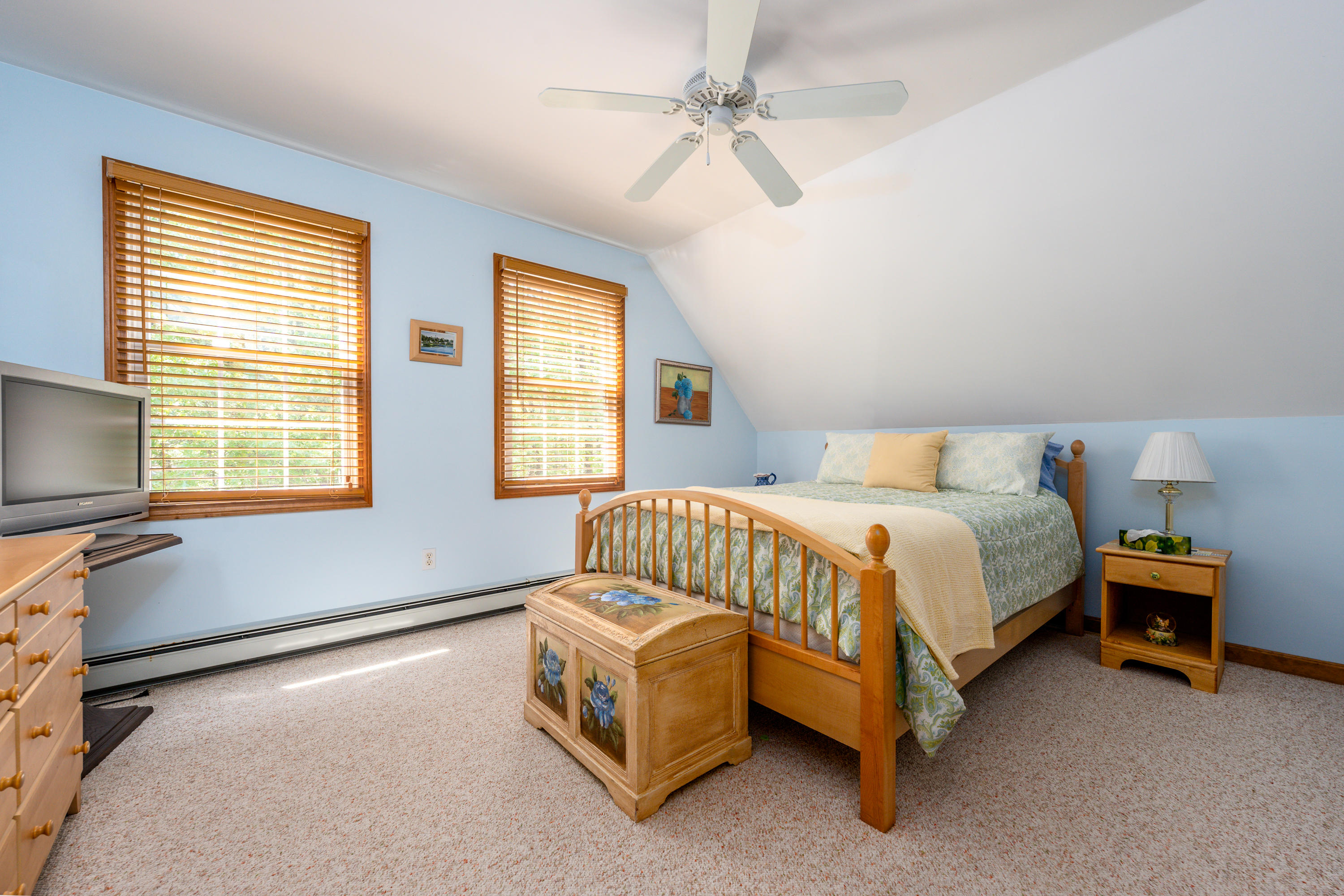 130 Browns Neck Road Wellfleet, MA 02667 - Photo 19 of 40 a bed sitting in a bedroom next to a window